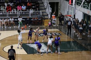 Sophomore forward Allie Myers draws a foul and scores a free throw for the Lady Saints. She maintained her aggressive play style, supporting the team’s offensive momentum.