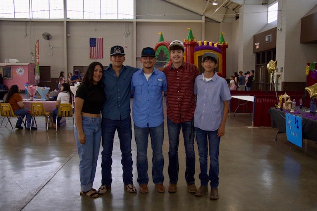 A group of young adolescents pose for a photo at the Celebrate and Connect Fest, enjoying the event's vibrant atmosphere.