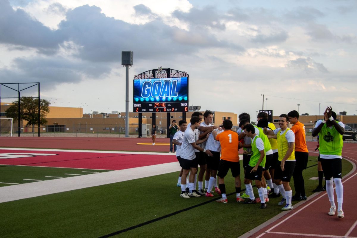 Saints Soccer team celebrates another goal against Tabor College.