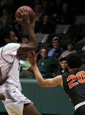 Isiah Small attempts to move around to Cowley defenders. Small had 22 points in the loss to Cowley.