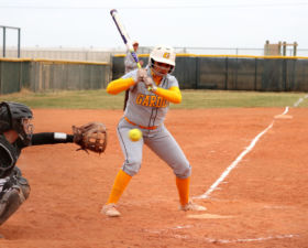 Sophomore, Sage Harrison, prepares to catch and frame a pitch. Harrison played catcher for both games in the double-header against GCCC.