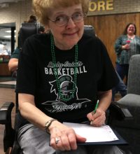 Former SCCC employee of 20+ years and Lady Saints fan, Virginia Bruce took stats of the game vs Gulf Coast State.