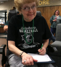 Former SCCC employee of 20+ years and Lady Saints fan, Virginia Bruce took stats of the game vs Gulf Coast State.