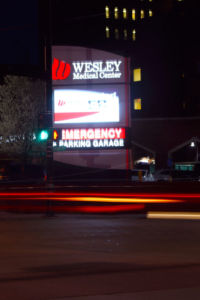 The hustle and bustle of traffic in the streets of Wichita on a cold Sunday night helps illuminate the city even more. Street lights and restaurant signs help to light up Wichita’s streets.