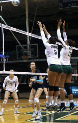 Sophomores Luz Sierra and Esmadar Tavares block a Colby Community College hit. As a team, the Lady Saints finished with six blocks.