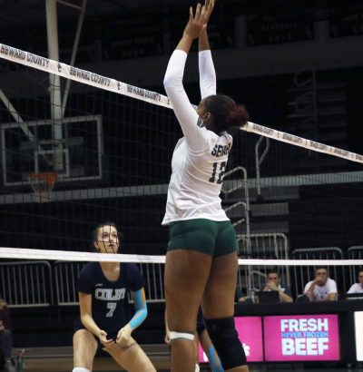 Sophomore Luz Sierra blocks a Lady Trojan hit. Sierra finished the night with six blocks, making it her third match with at least four blocks.