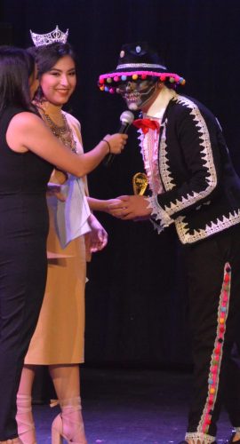 Julian Avila shows off traditional face painting for the Day of the Dead. Janeth Vazquez, moderator, asked Avila questions about the "scary" style.