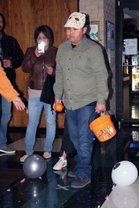 Aadyn Miranda, dressed up as Jason from the scary movie Friday the 13th, plays bowling at SCCC’s Trick or Treat Street.