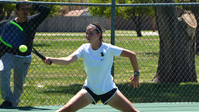 Sophomore Maria Aveiga from Guayaquil, Ecuador is an engineering major at SCCC. Avegia reaches out and forehands a ball during the Region VI tournament at Blue Bonnet park.