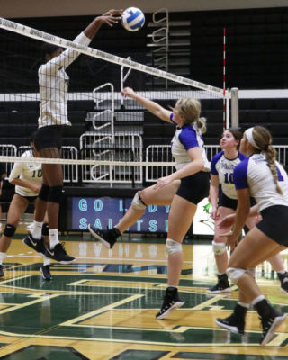 Freshman, Mesalina Serverino, has a solo block for the Lady Saints as she helps with getting a point against the lady beavers.