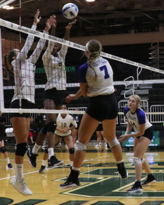 Sophomore, Laura De Pra and freshman Mesalina Serverino, go up for a block to stop the Lady beavers from scoring.
