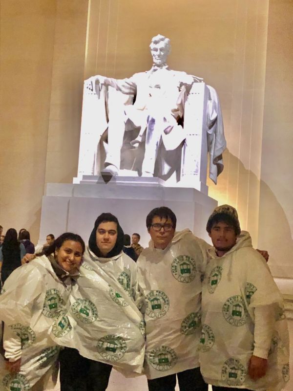 Crusader staff members are soaking wet and cold but still smile and pose in front of the Lincoln statue. Monica Gonzalez, Calen Moore, Josh Swanson and Kris Liggett braved a wet night to go on a Moonlight Monuments tour during the 2019 ACP/CMA National Collegiate Conference in Washington DC.