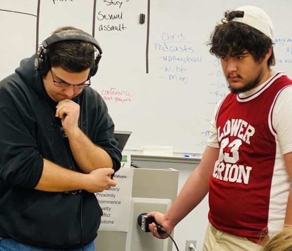 Playing around with some recording equipment, Calen Moore and Kris Liggett create audio for a finals parody video.