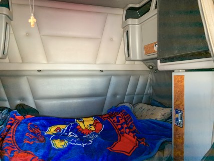 Inside a 53 foot tall semi, you will find that the cab holds a sleeping space for the driver. Cabinets, a fridge and even a TV could be included in the living quarters of a semi truck, which helps the trucker rest in between stops and long trips.