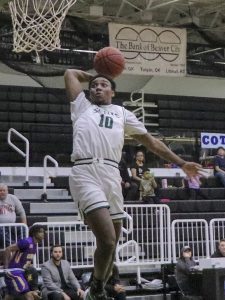 Stephen Takyi skies for the uncontested dunk after stealing the ball. He ended the night with 12 points as the Sains blew past Dodge City Community College, 92-56, on Feb. 11.