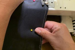 The first step in sewing a mask is to measure the fabric, cut the pattern out and sew all four sides of the mask, leaving at least two inches of space open for the filter to fit inside.