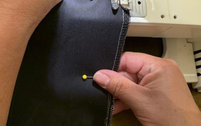 The first step in sewing a mask is to measure the fabric, cut the pattern out and sew all four sides of the mask, leaving at least two inches of space open for the filter to fit inside.
