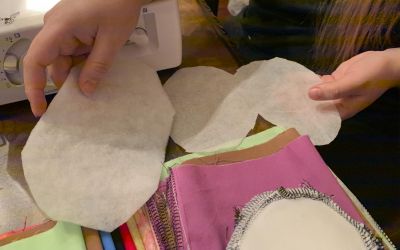 Next, a filter is made with polyethylene fabric and pellon interfacing for layers inside the filter. The polyethylene fabric will be folded together, to be sewn. Once finished, the filter is placed inside the reusable cloth mask.