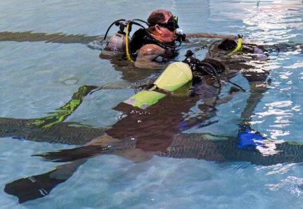 Students practice, with instructor Mike Hale, on steps to take when they run out of oxygen at the Wellness Center pool in SCCC. In this lesson, Hale turns off his student’s tanks for them to know how it feels to run out of oxygen and what to do.