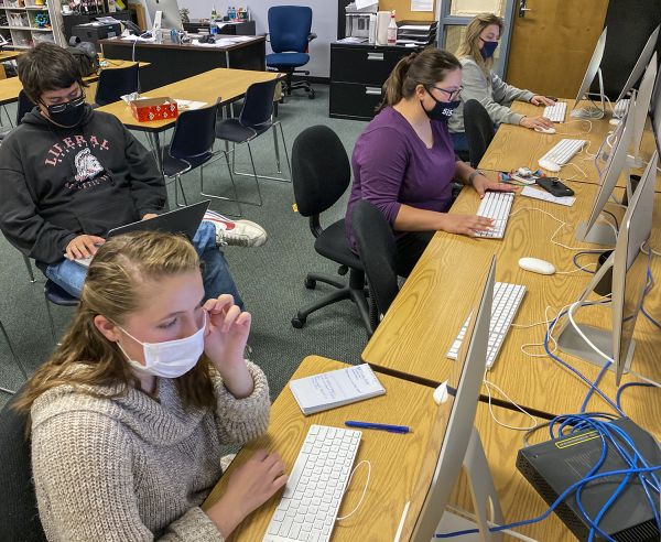 Working on team projects looks a little different this semester due to social distancing. This news team project has staff spread out all over the class instead of clumped together. A shared drive and document make social distancing so much easier.