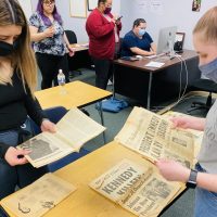 Crusader Staff were busy admiring the donated newspapers, as a break from brainstorming ideas for the week.