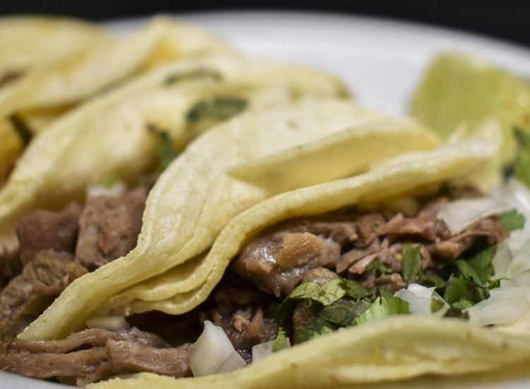 All tacos are mainly served with onions, lime, and cilantro.