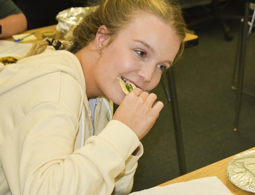 Reece Hay, freshman business major, tastes the carne asada taco. Hay rated the tacos with a 10/10. She’d go back for more.